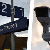 Bahnhofsschild und Videokamera