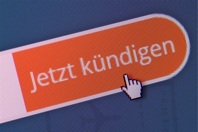 Ein Button auf einem Bildschirm mit dem Schriftzug „Jetzt kündigen“.