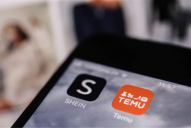 Die Apps der Internethändler Temu und Shein sind auf dem Display eines Smartphones zu sehen.
