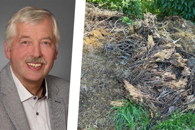Bernhard Albers, Ortsvorsteher von Unna-Billmerich, neben einem Haufen aus Grünschnitt und Gartenabfällen.